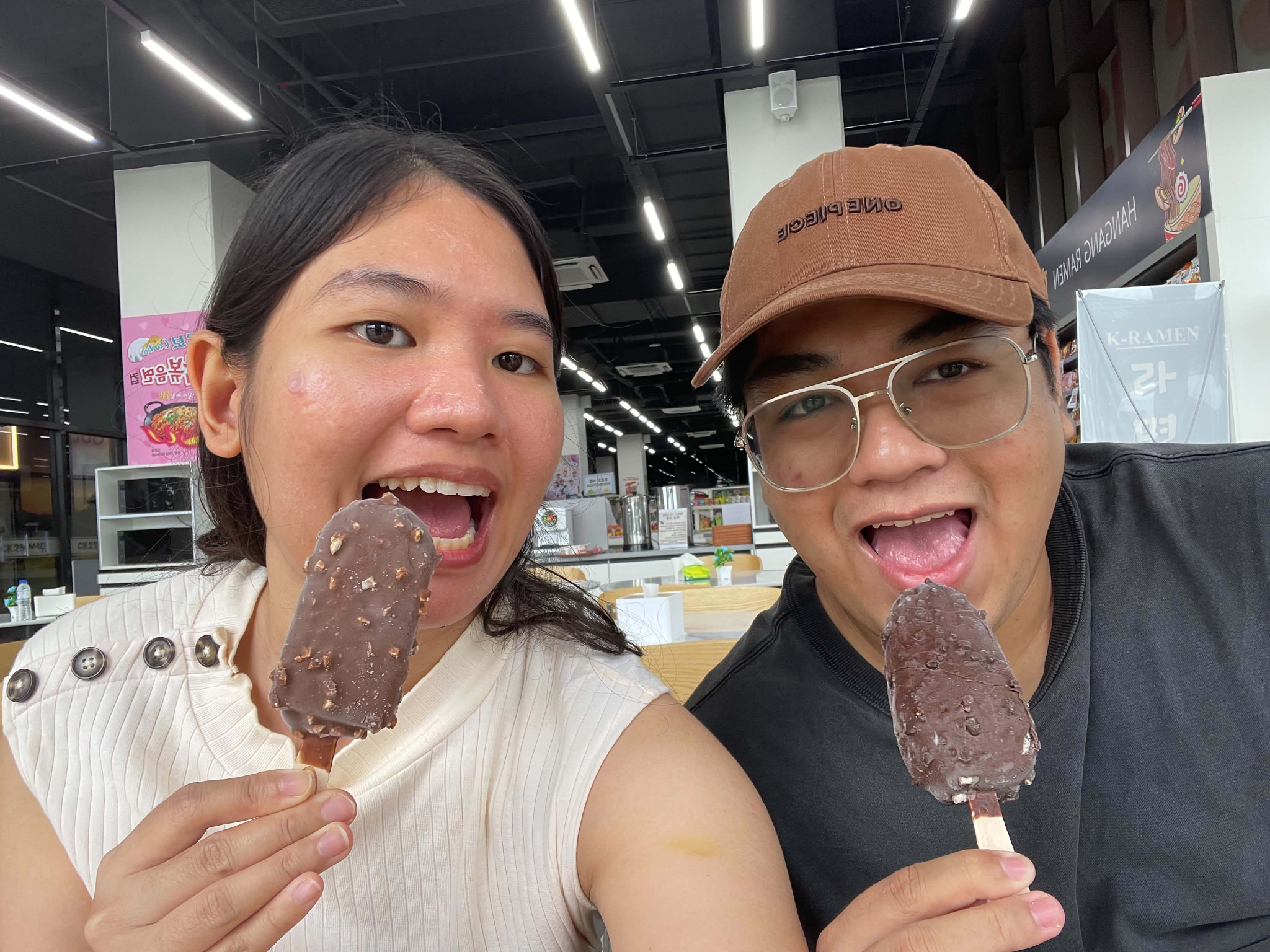 A fun selfie together while eating ice cream.