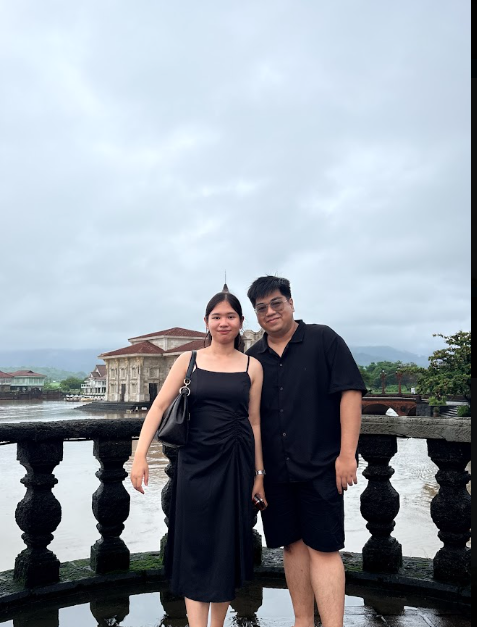 A photo of us standing together by the riverside.